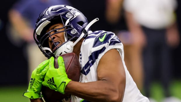 Seattle Seahawks wide receiver Tyler Lockett (16) catches a touchdown pass against New Orleans Saints cornerback Paulson Adebo (29) during the second half at Caesars Superdome.